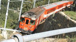 A train emerges from a circular tunnel climb at Deisch, 2.7 miles into the ride